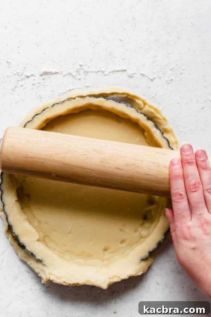 The tart shell perfectly fitted in the pan