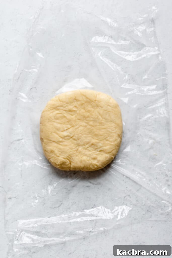 Creaming butter and sugar together in a stand mixer bowl for pâté sucrée dough.