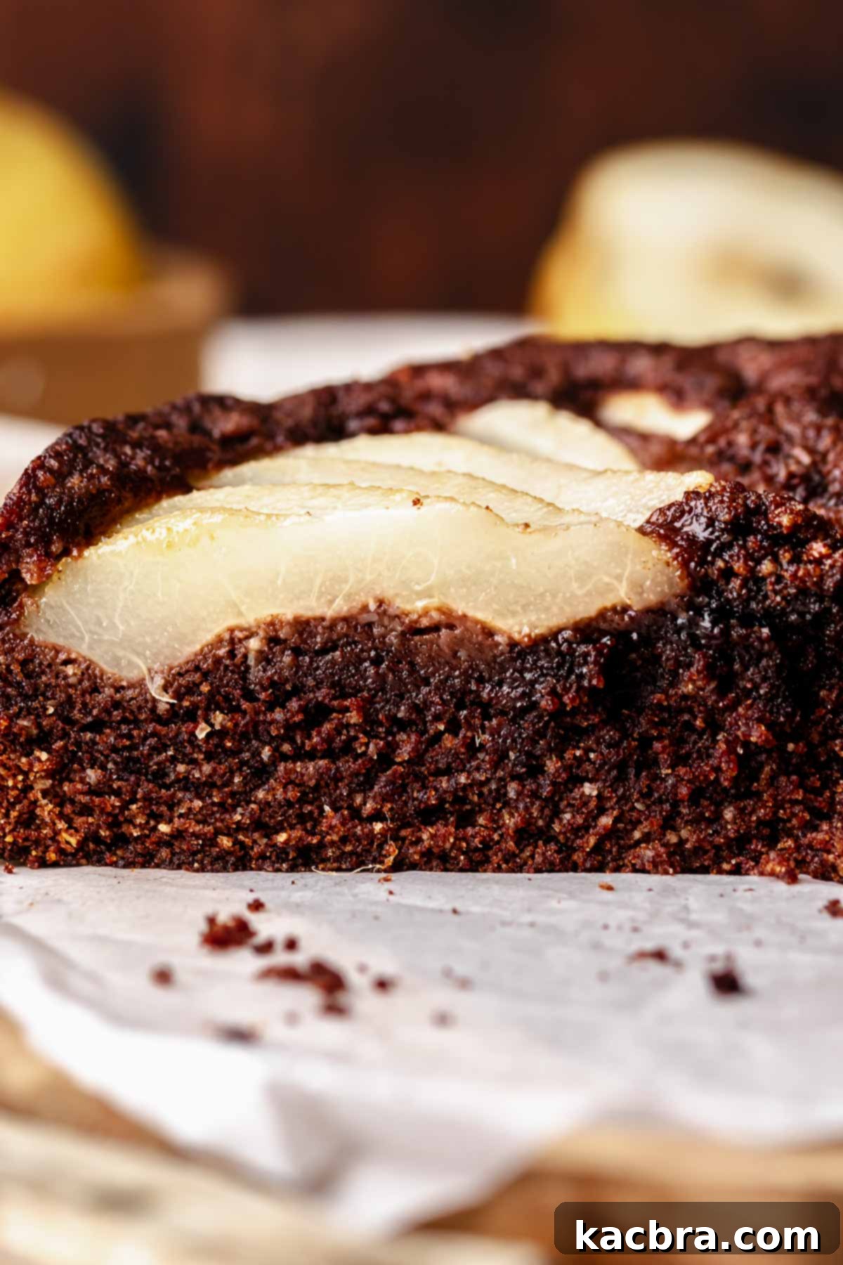 Pear-Kissed Chocolate Cake 13 A slice of chocolate pear cake exposing the side.