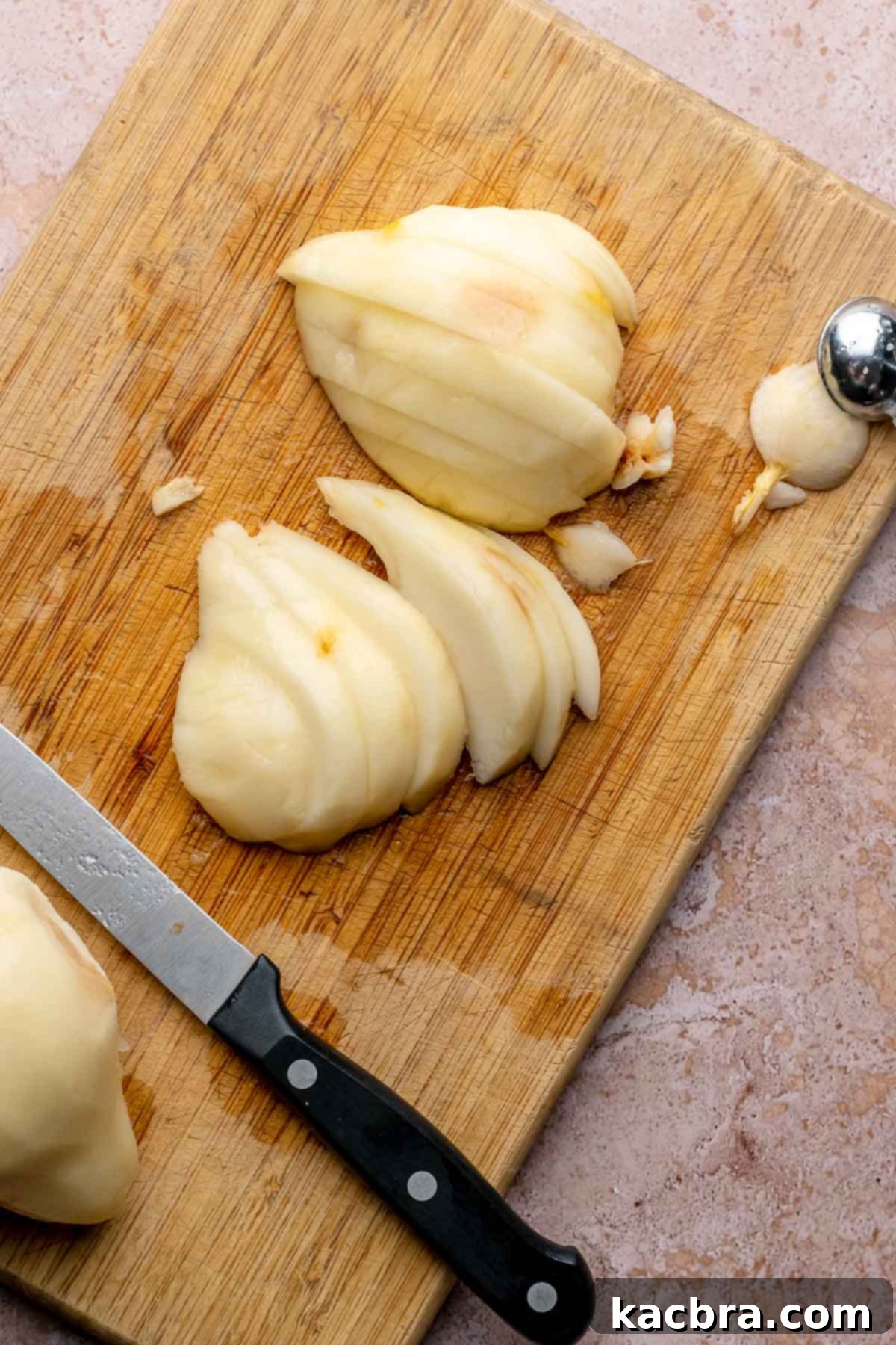 Pear-Kissed Chocolate Cake 8 Sliced pears on a cutting board.