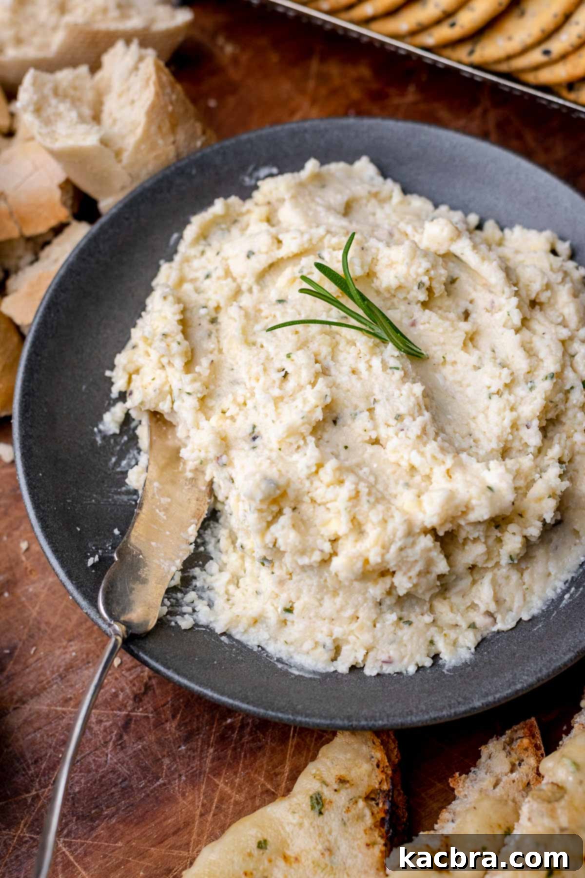 Potent French Cheese Spread 2 Fromage fort in a bowl with a spoon, ready to be served.
