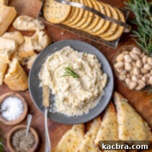 Potent French Cheese Spread 10 Fromage fort in a bowl with dippers around.