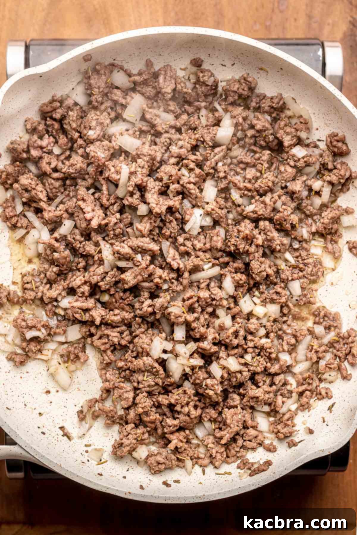 Cooked ground beef in a pan.