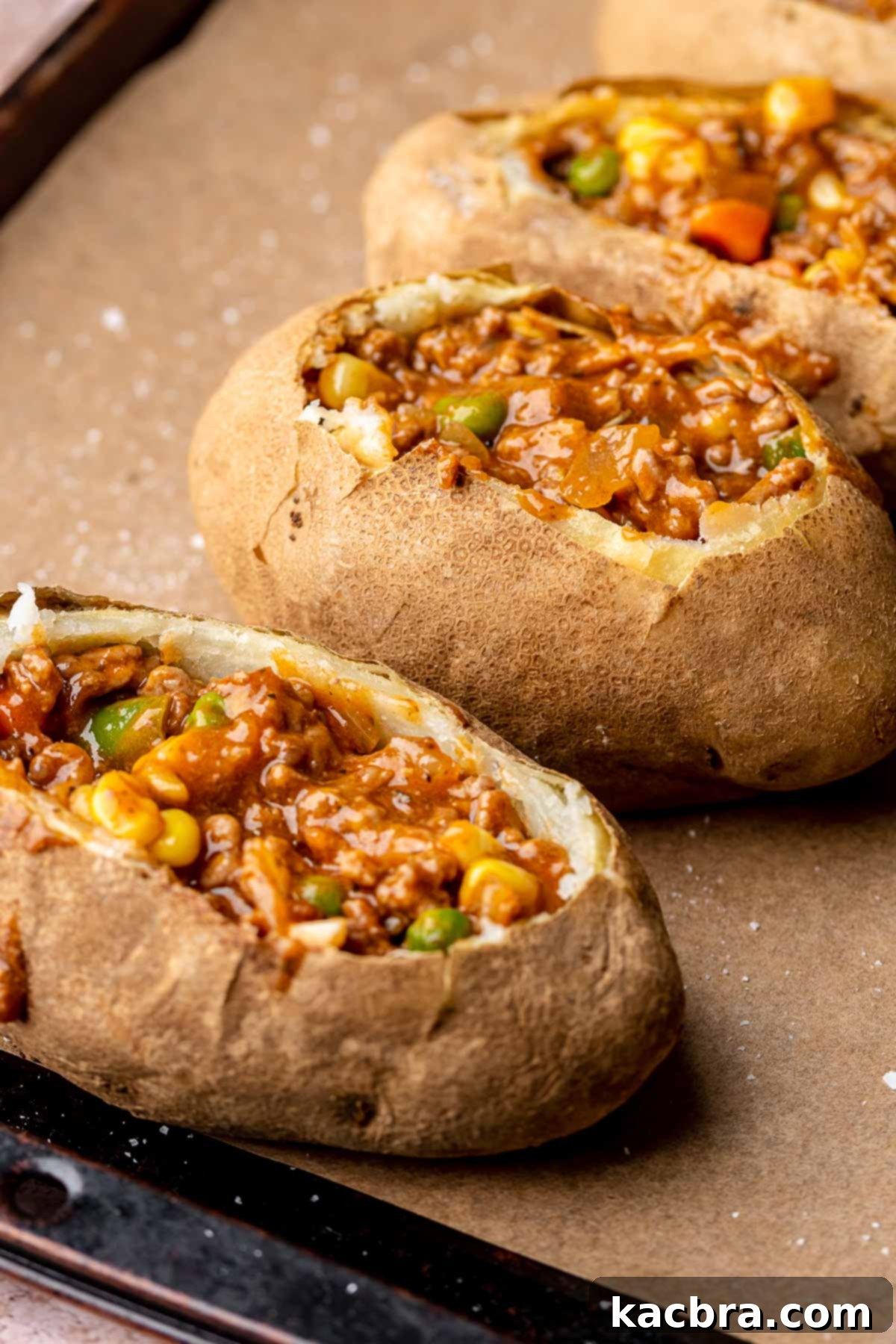 Baked potatoes filled with ground meat filling.