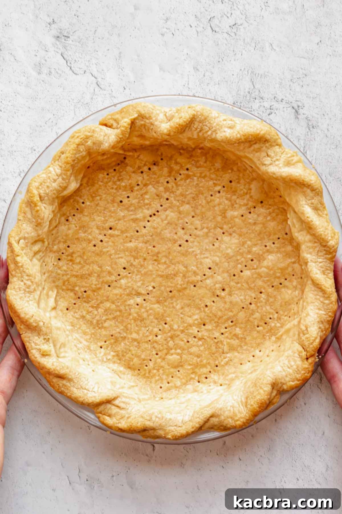 A perfectly blind-baked pie crust, golden-brown and crisp throughout, ready for a no-bake filling.