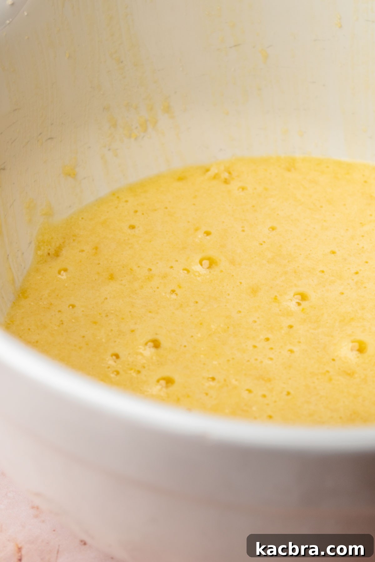 Golden Lemon Pistachio Dream with Honey Mascarpone Cloud 7 Eggs and vanilla extract added to the creamed butter and sugar mixture, ready for mixing.