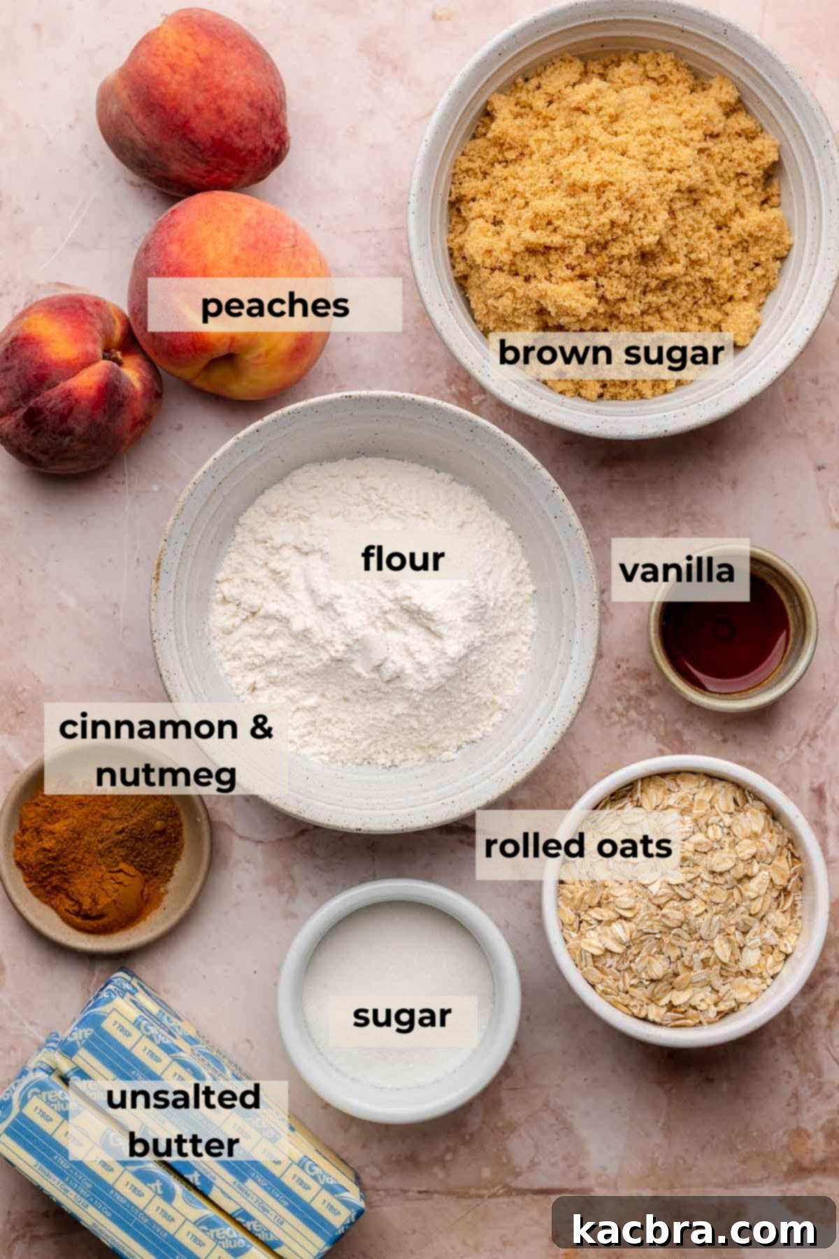 Ingredients laid out for brown butter peach crumble bars, including butter, flour, sugars, spices, oats, and peaches.