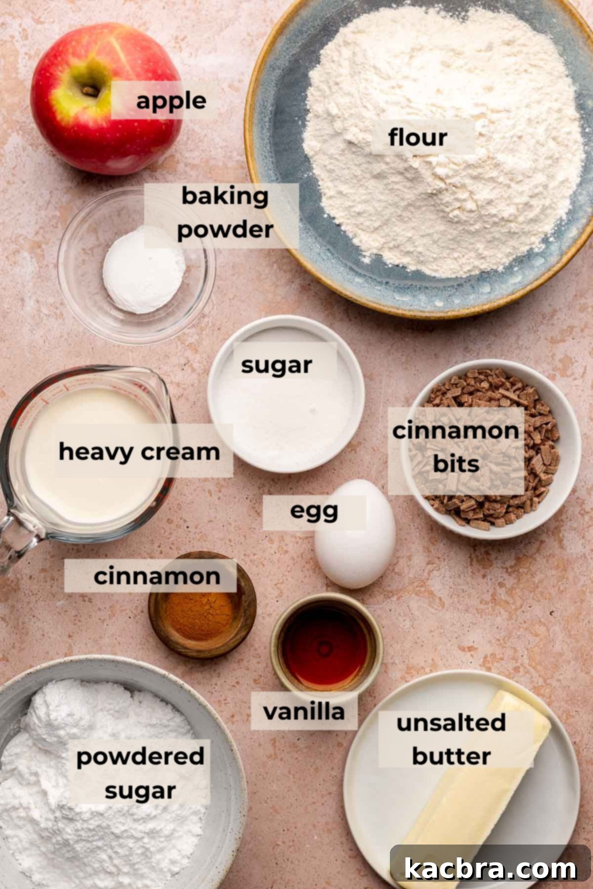 A vibrant display of fresh ingredients for apple cinnamon scones, including apples, flour, butter, and cinnamon.