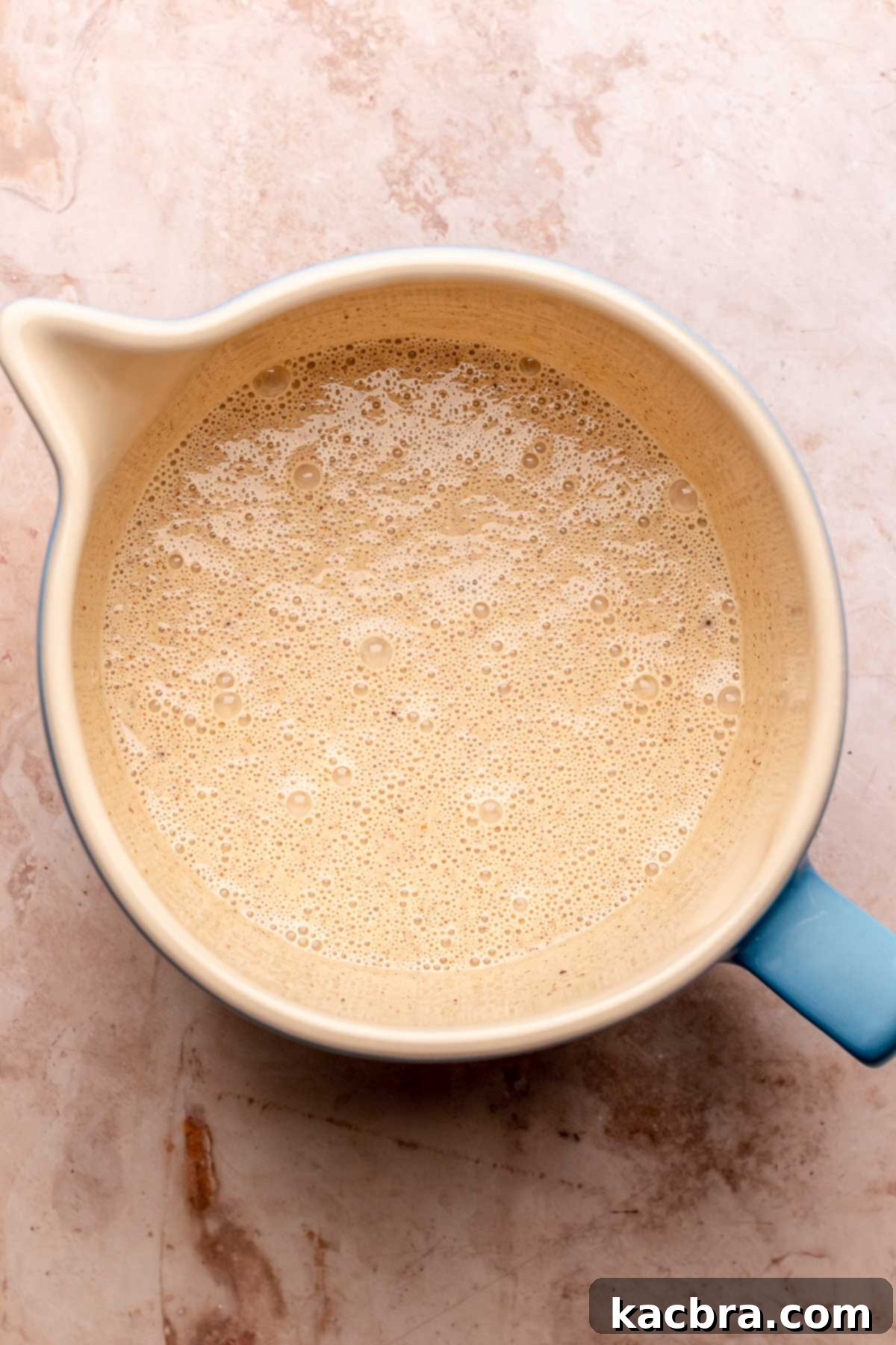 Eggnog custard in a mixing bowl, third step.
