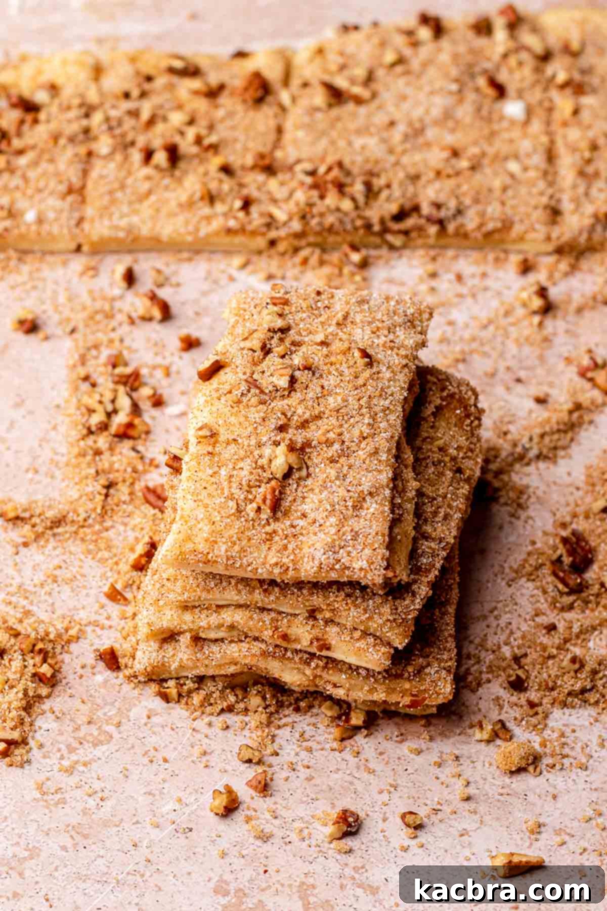 A stack of sugared, rectangular dough pieces, ready for the loaf pan.