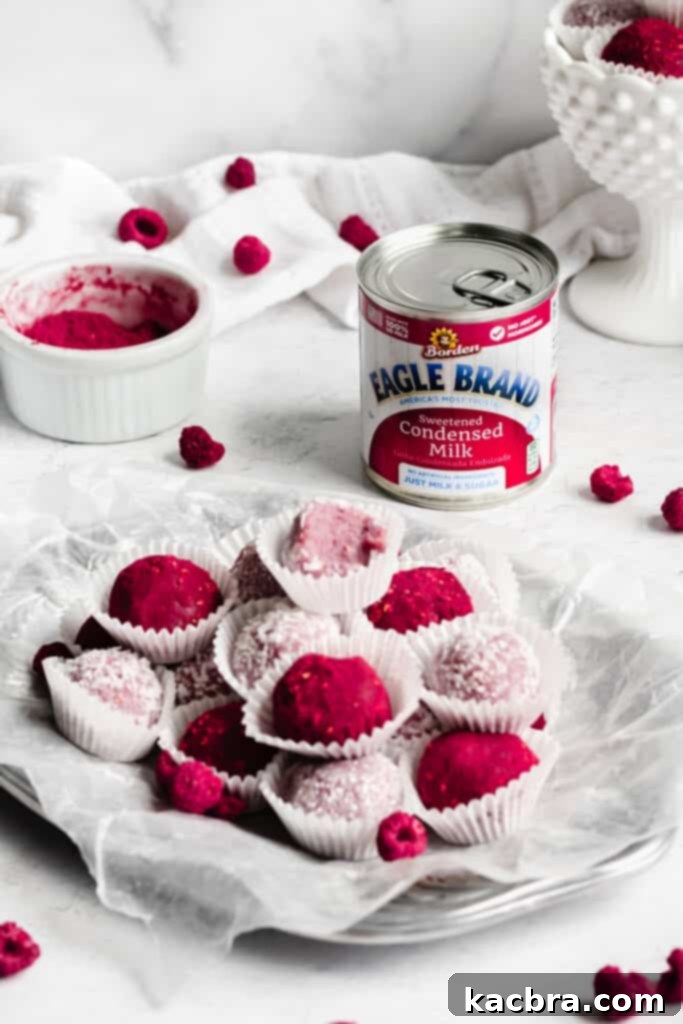 A beautiful platter of raspberry brigadeiros, artfully arranged, with a can of Eagle Brand sweetened condensed milk resting in the background, hinting at the key ingredient.
