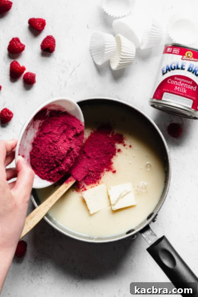 The initial raspberry brigadeiro mixture in a saucepan, beginning to thicken during the cooking process.