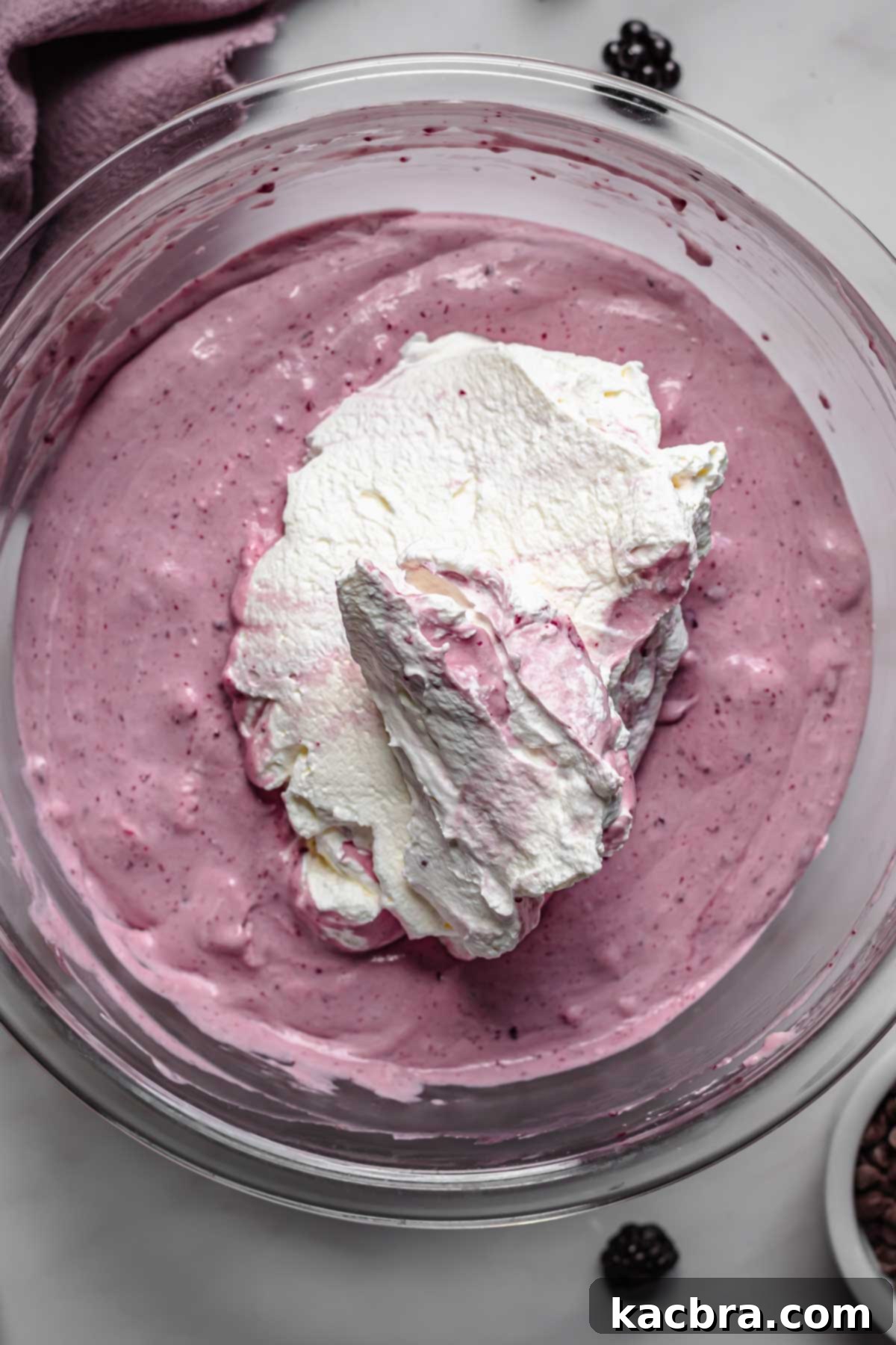 Whipped cream in the bowl of soft ice cream.