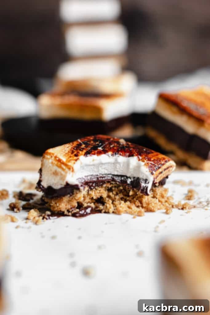 straight on shot of a smores bar with a bite removed