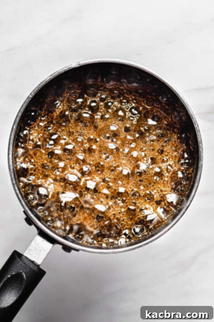 Brown sugar syrup bubbling and reaching temperature.