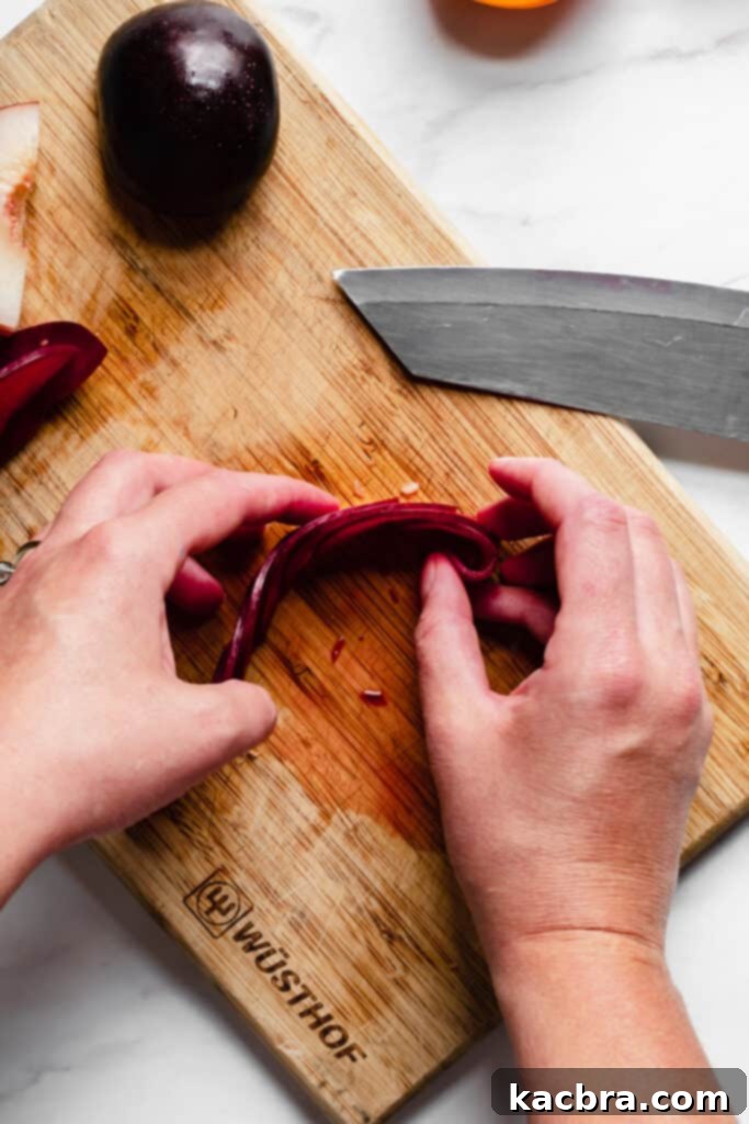 Rolling stone fruit slices into a rose shape, showing progression.