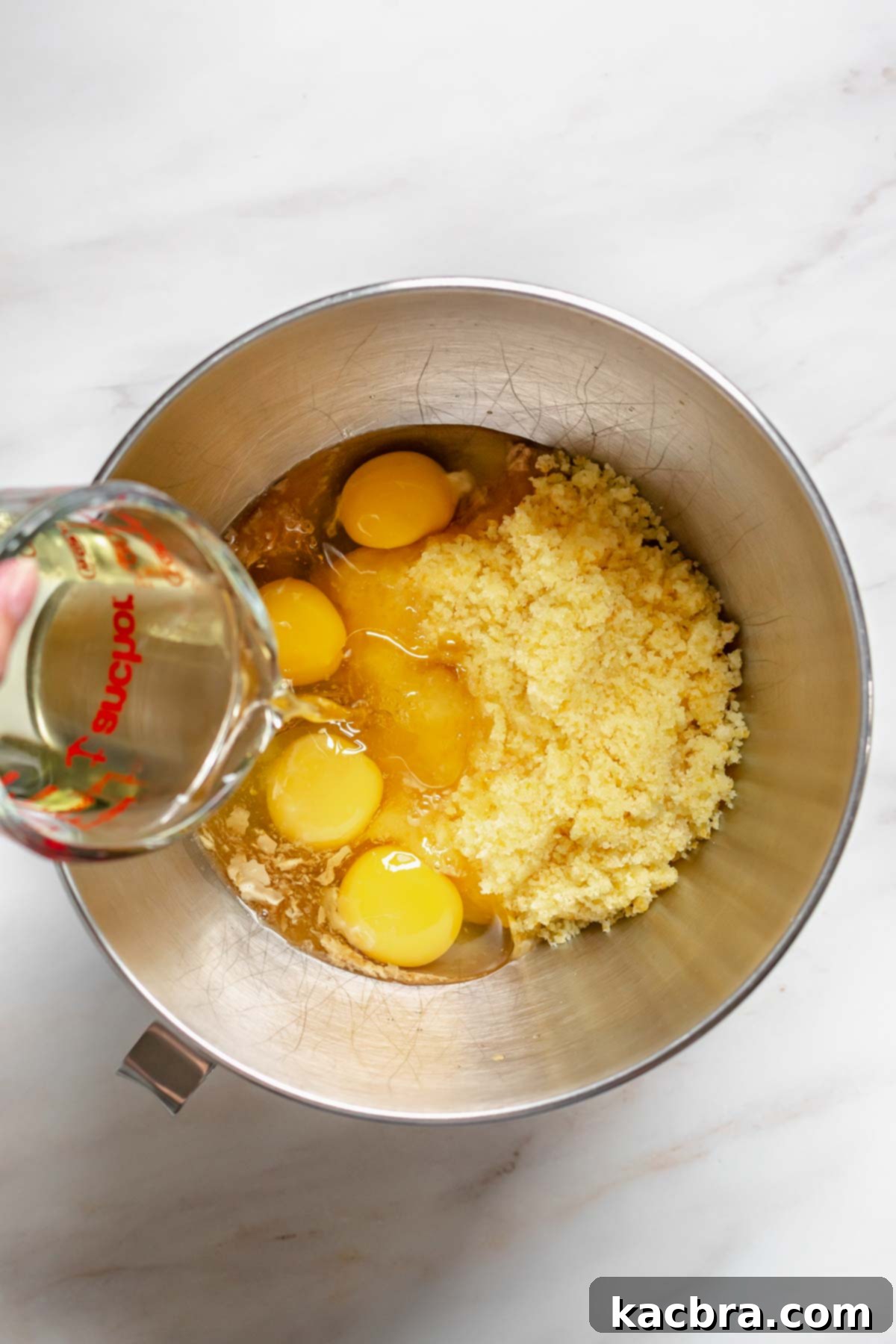 Oil pouring into a bowl.