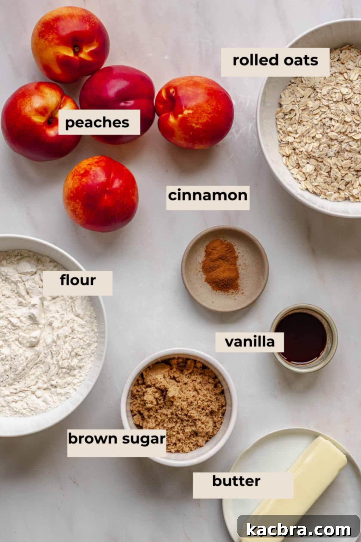 A selection of fresh ingredients laid out, including sliced peaches, brown sugar, cardamom, flour, oats, and a bowl of browned butter.