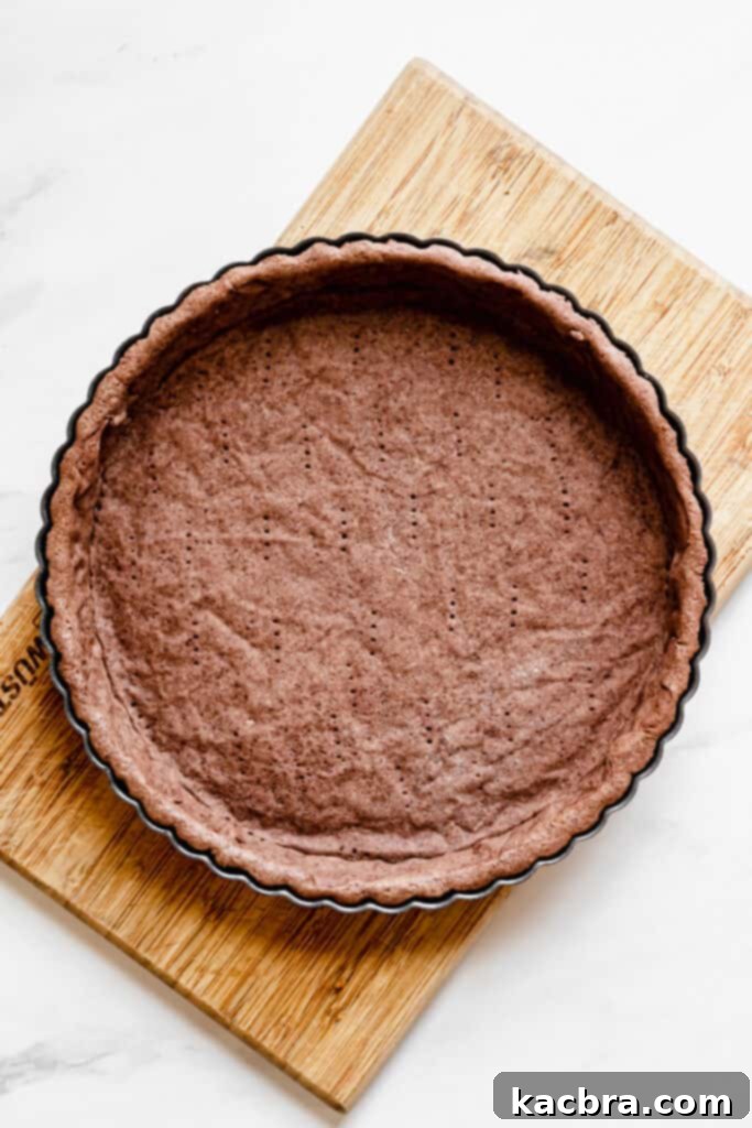 Fully blind-baked chocolate tart crust, crisp and uniformly baked