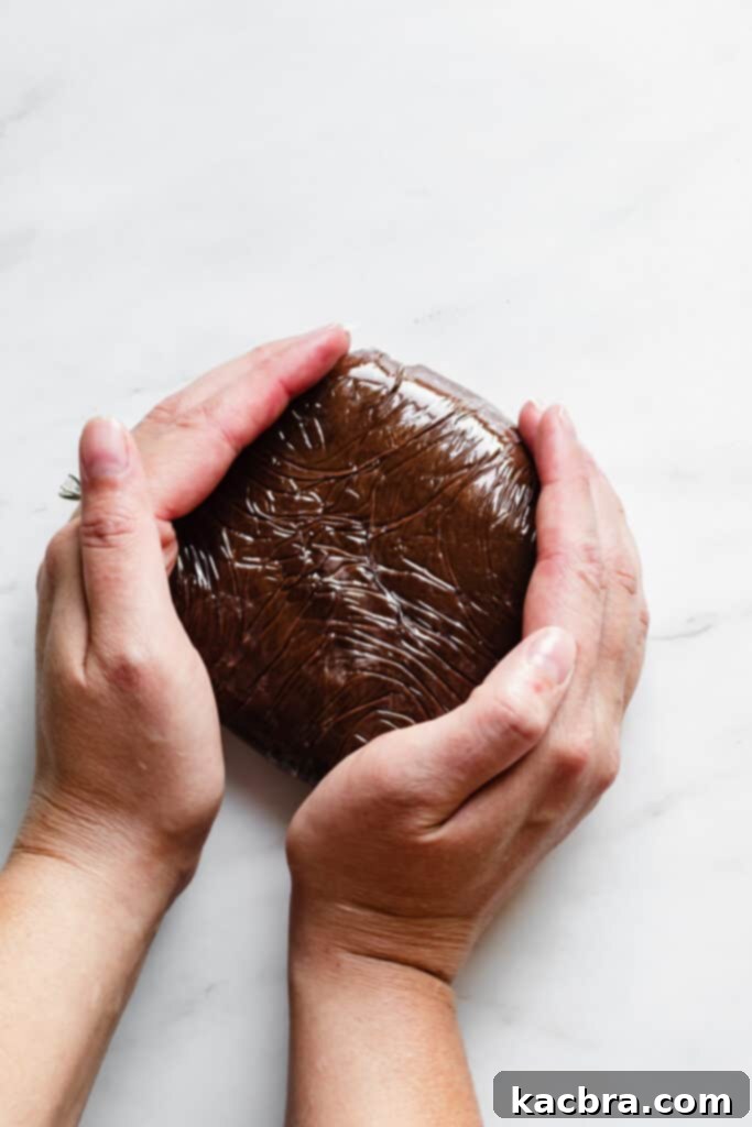 Chilling chocolate tart dough wrapped in plastic