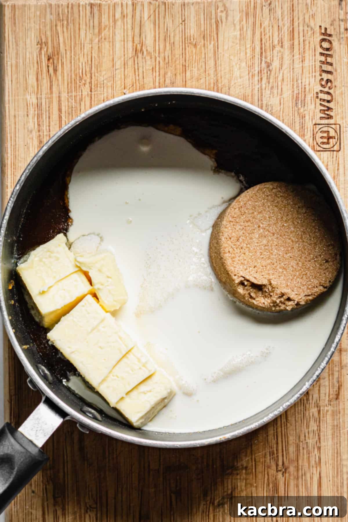 Decadent Caramel Pecan Cheesecake 12 Ingredients for the apple cider caramel sauce, including reduced apple cider, butter, brown sugar, and heavy cream, combined in a saucepan.