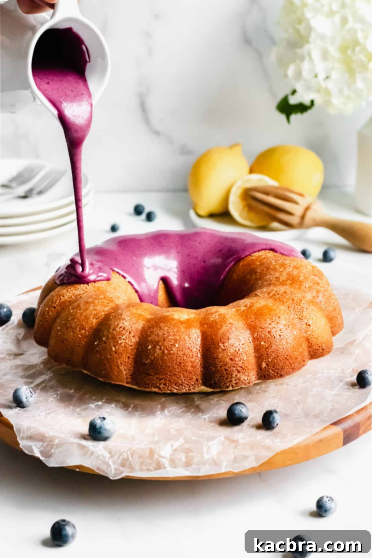 Velvet Lemon Ricotta with Bursting Blueberry Glaze 2 A stunning Lemon Ricotta Cake, baked in a bundt pan and generously drizzled with purple blueberry glaze.