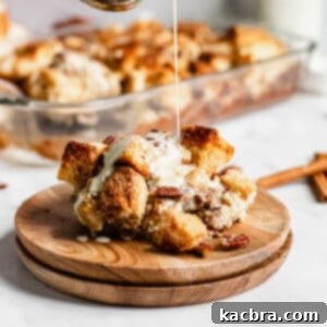 Bourbon sauce being poured onto the bread pudding