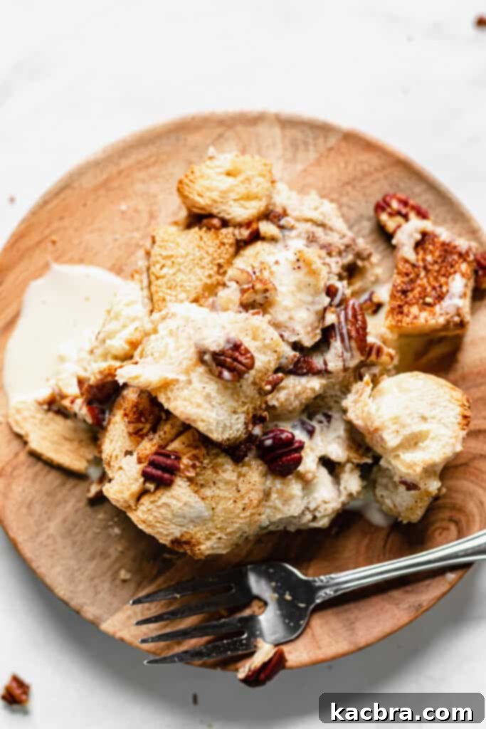 Close-up of baked bread pudding with a golden crust and soft interior.