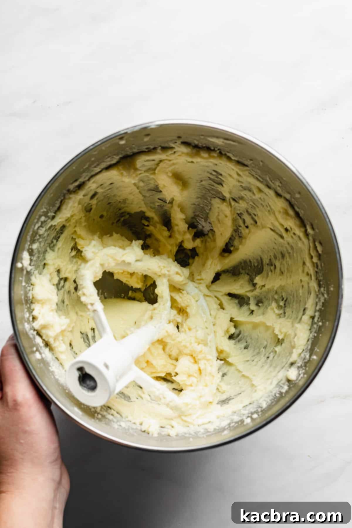 Creamed butter and sugar in a bowl.