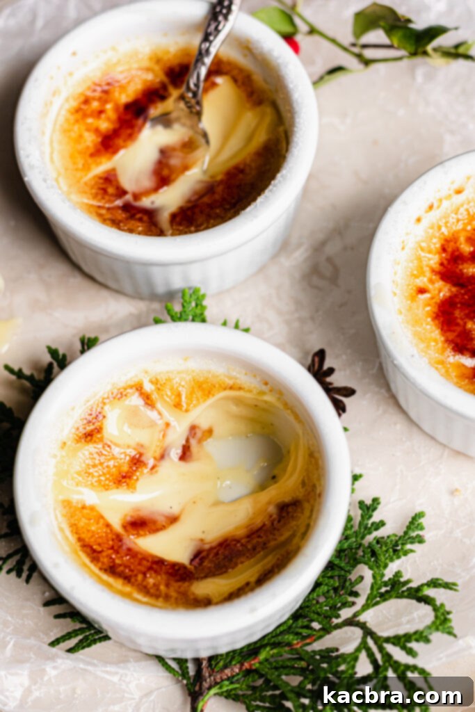 Spiced Eggnog Crème Brûlée 13 Beautifully presented Eggnog Crème Brûlée on a white dish with festive garnishes