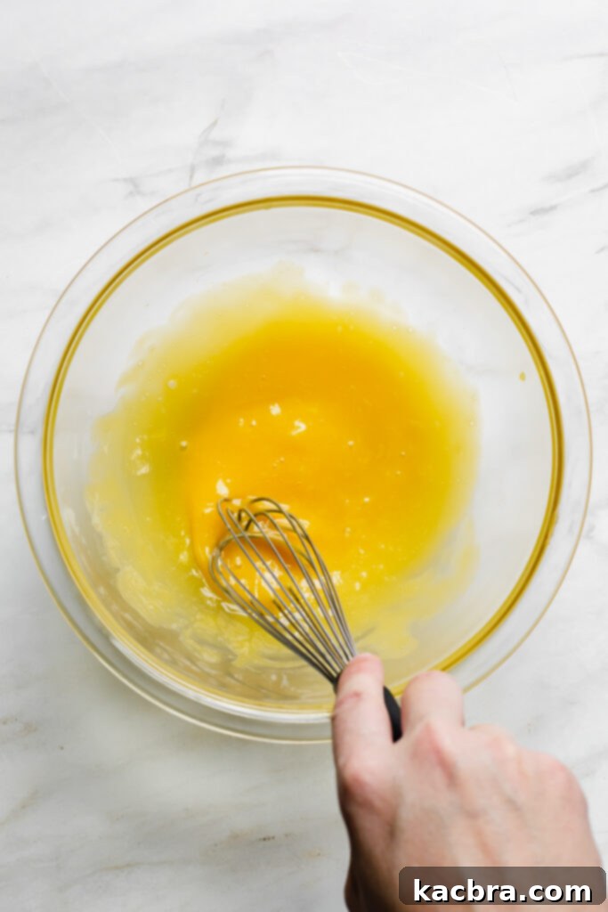 Spiced Eggnog Crème Brûlée 4 Whisking egg yolks in a bowl
