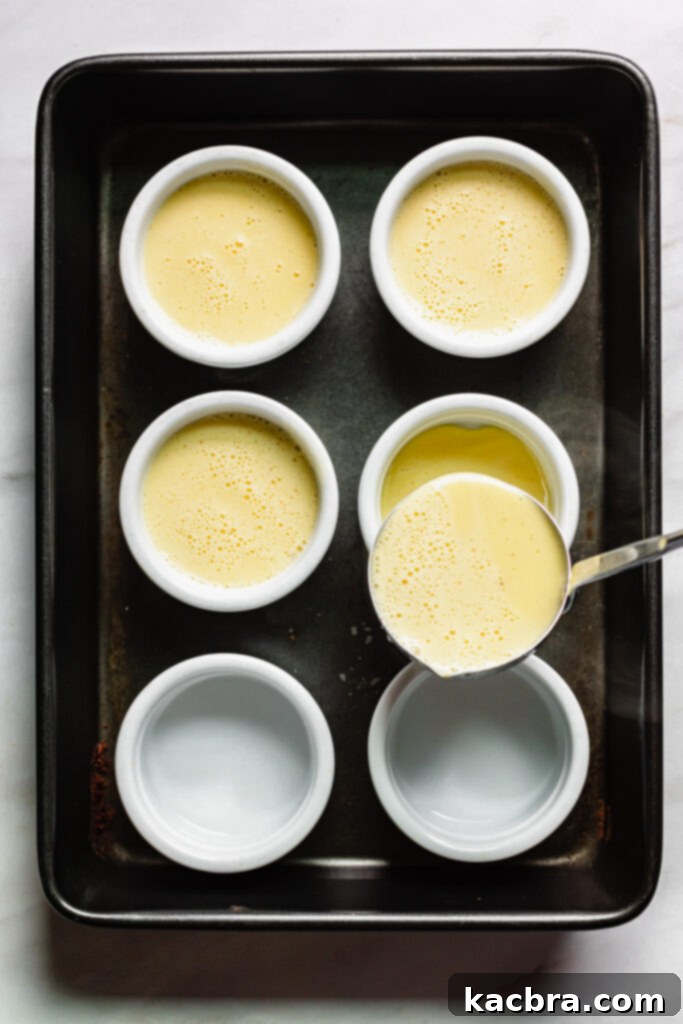 Spiced Eggnog Crème Brûlée 8 Baked crème brûlée custards in a water bath, showing jiggle