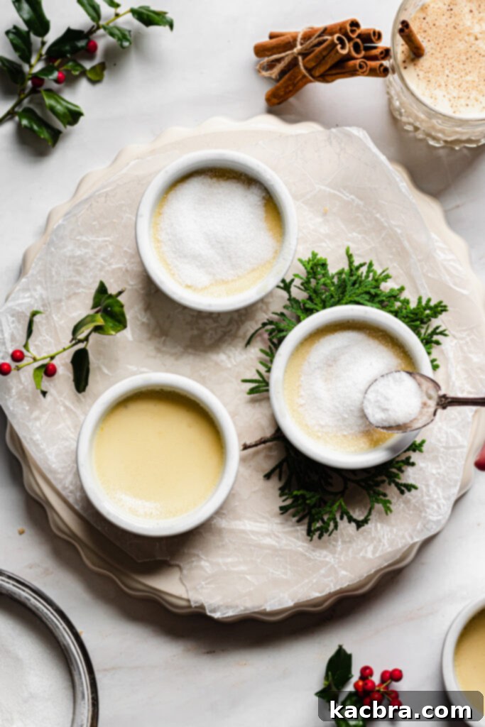 Spiced Eggnog Crème Brûlée 9 Sprinkling sugar on crème brûlée