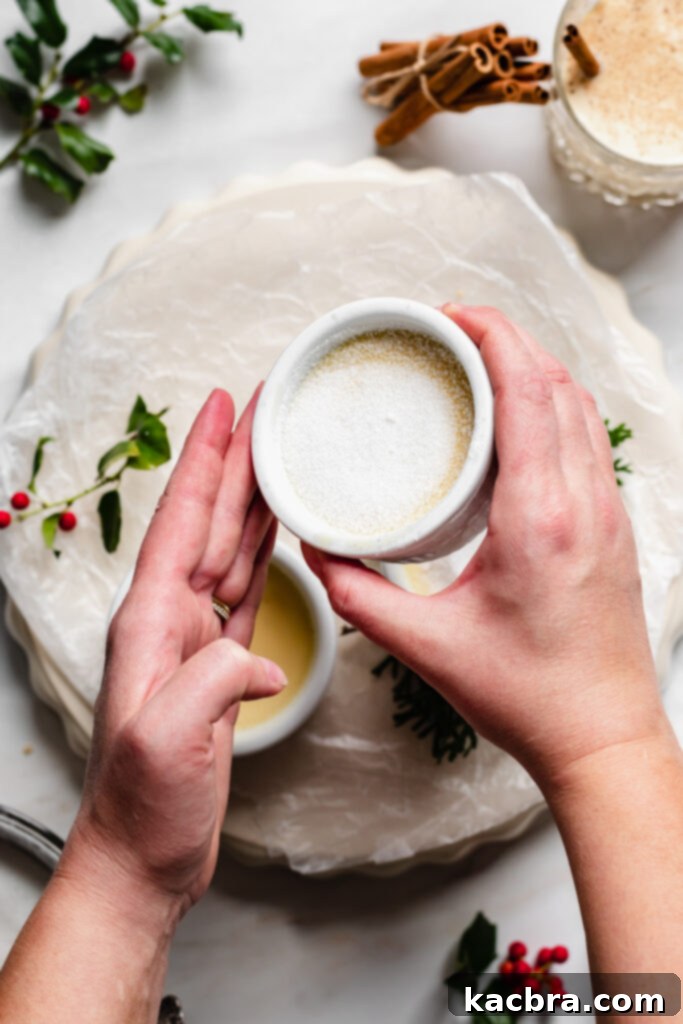 Using a kitchen torch to caramelize sugar on creme brulee.
