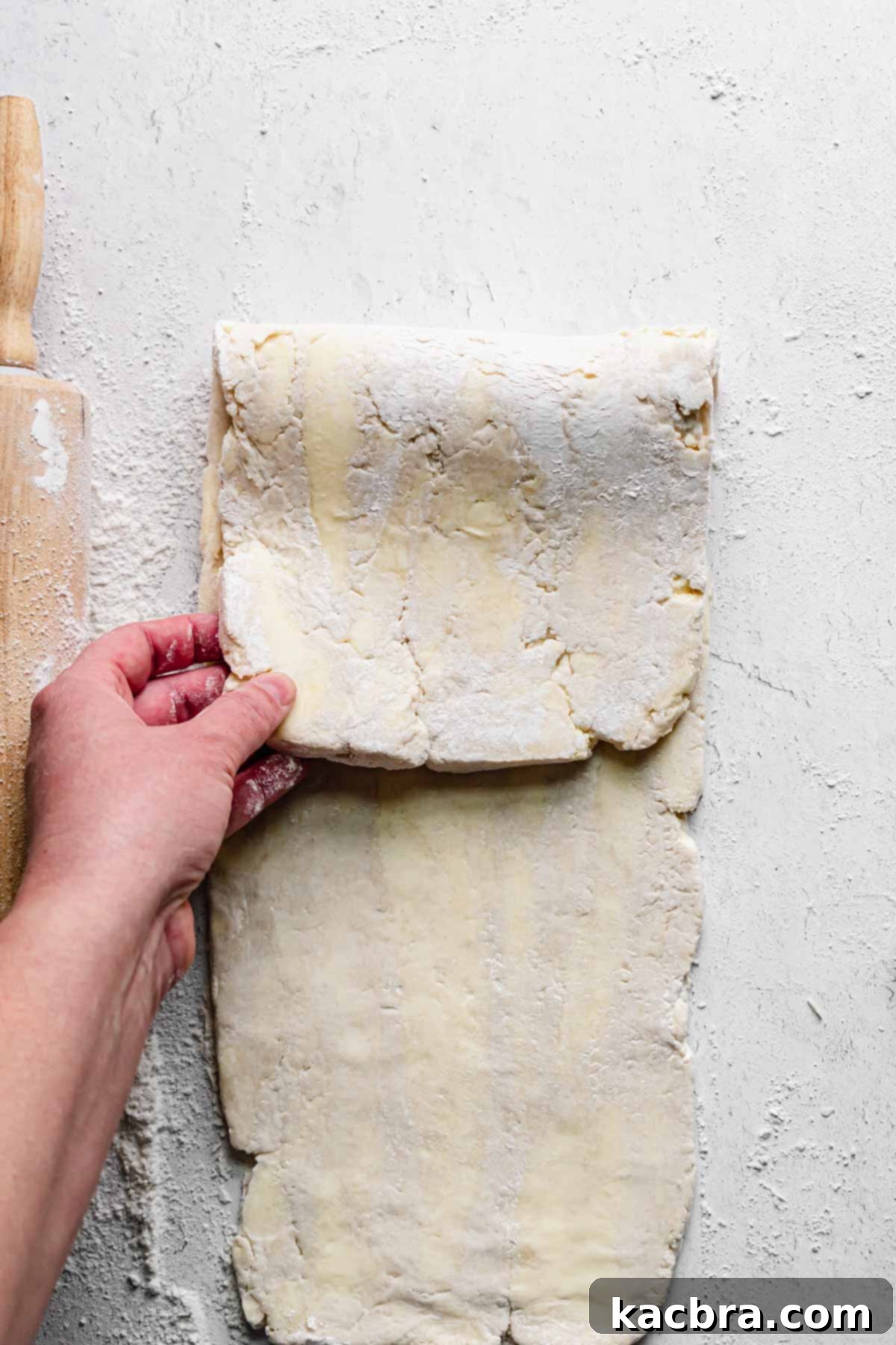 The top third of dough gets folded down.