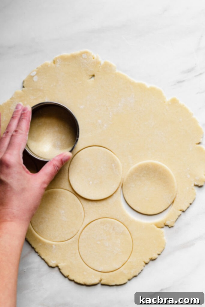 Cookie cutter cutting out tart dough