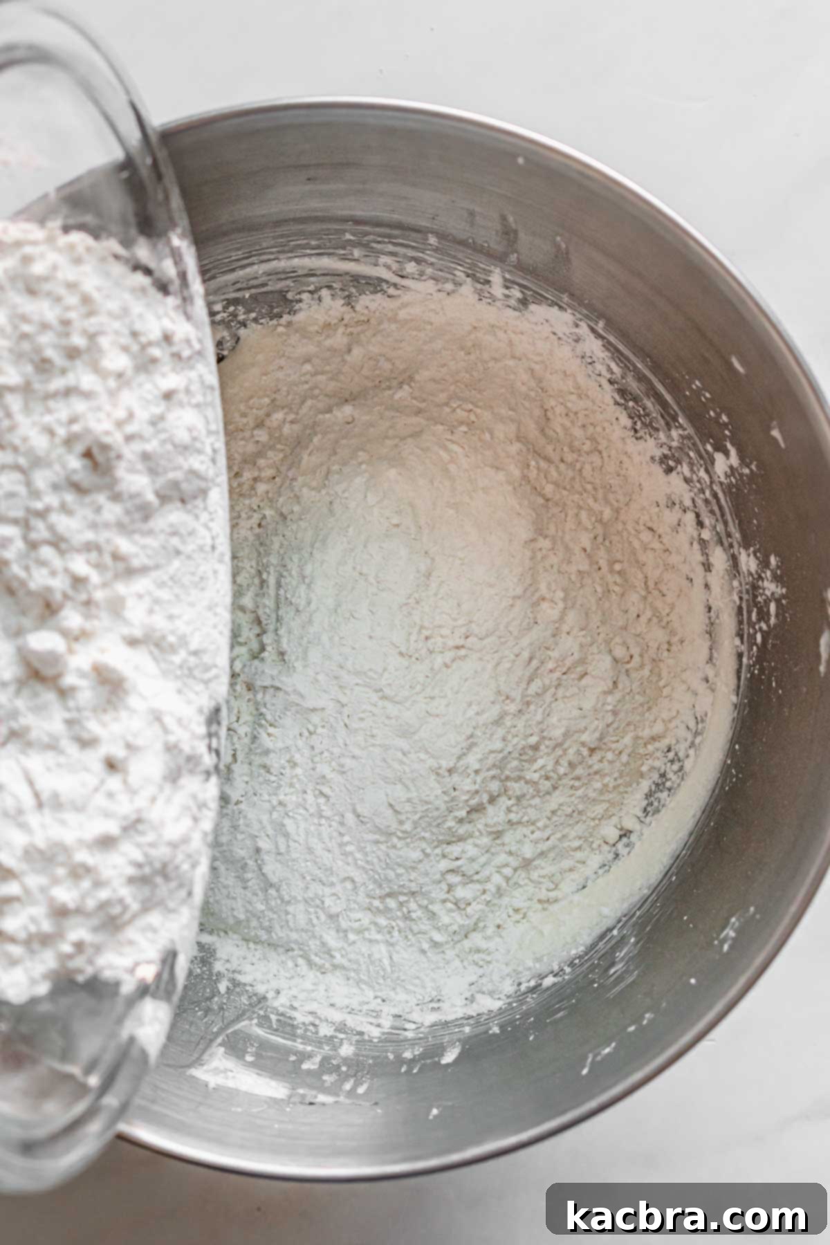 Double Strawberry Crunch Cupcakes 7 Half of the whisked dry ingredients, a light and airy mixture of flour, corn starch, baking powder, baking soda, and salt, are gently folded into the wet batter.