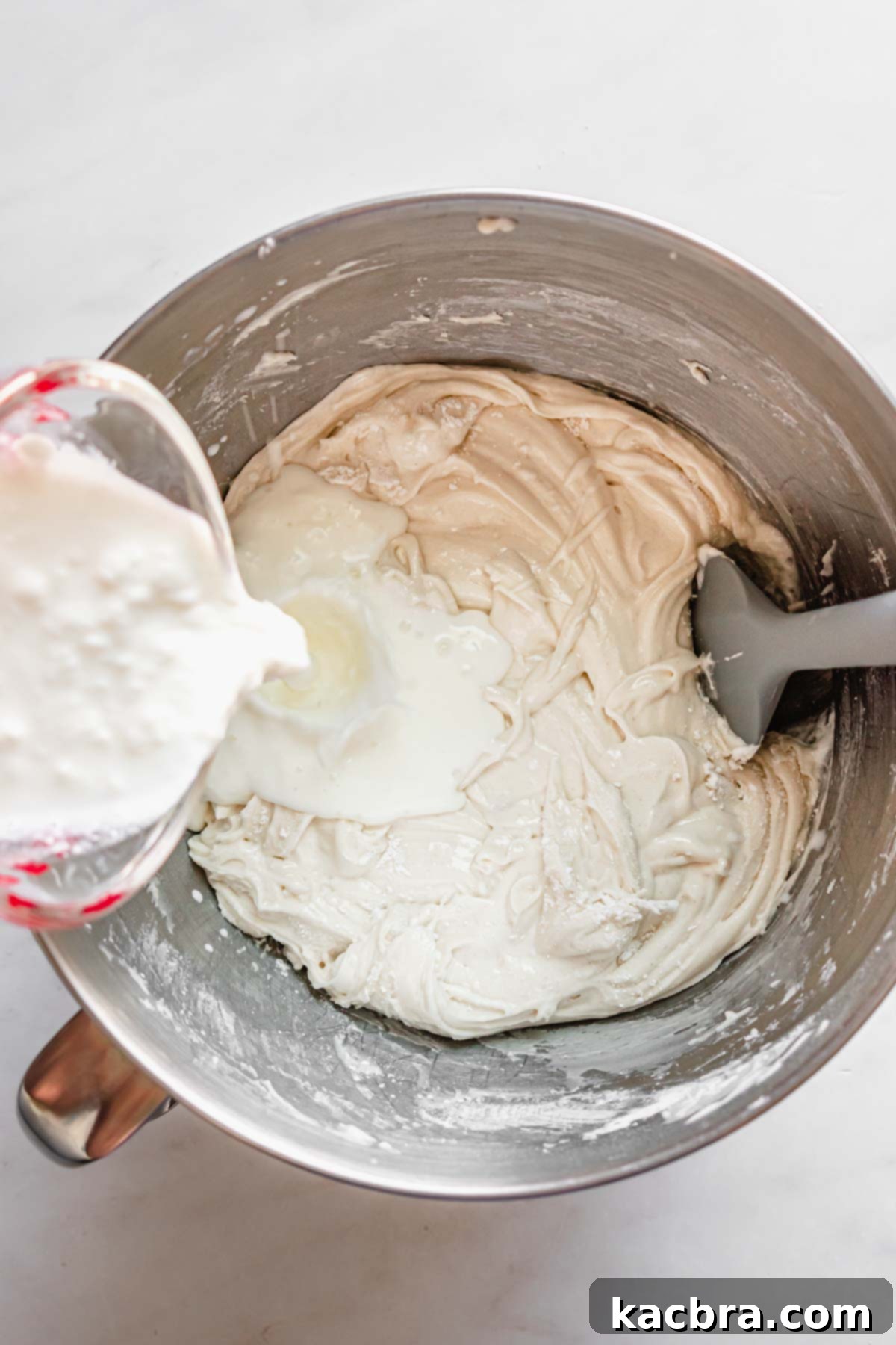 Double Strawberry Crunch Cupcakes 8 The creamy blend of milk and sour cream being incorporated into the cupcake batter, ensuring ultimate moisture and flavor.