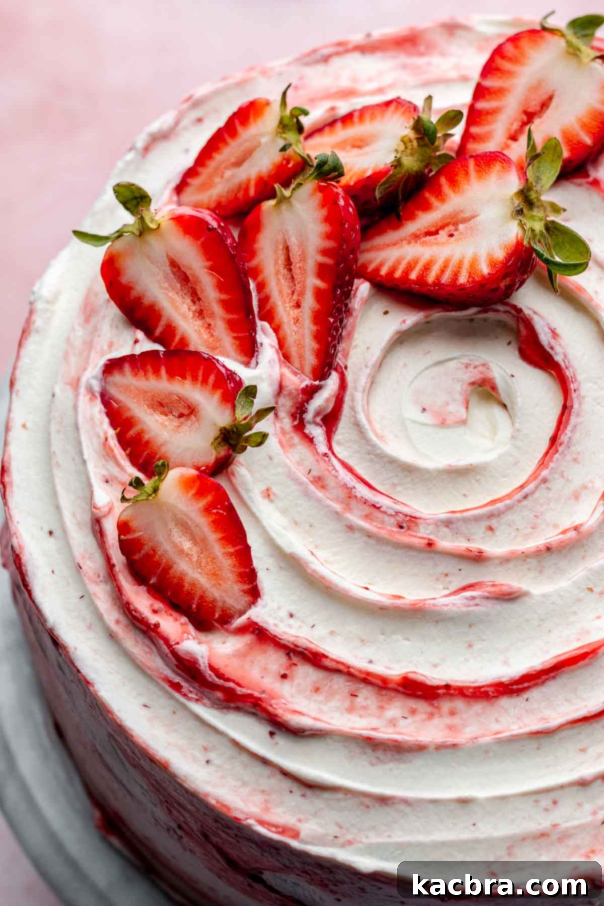 Decorated strawberry shortcake cake with fresh strawberries and whipped cream.