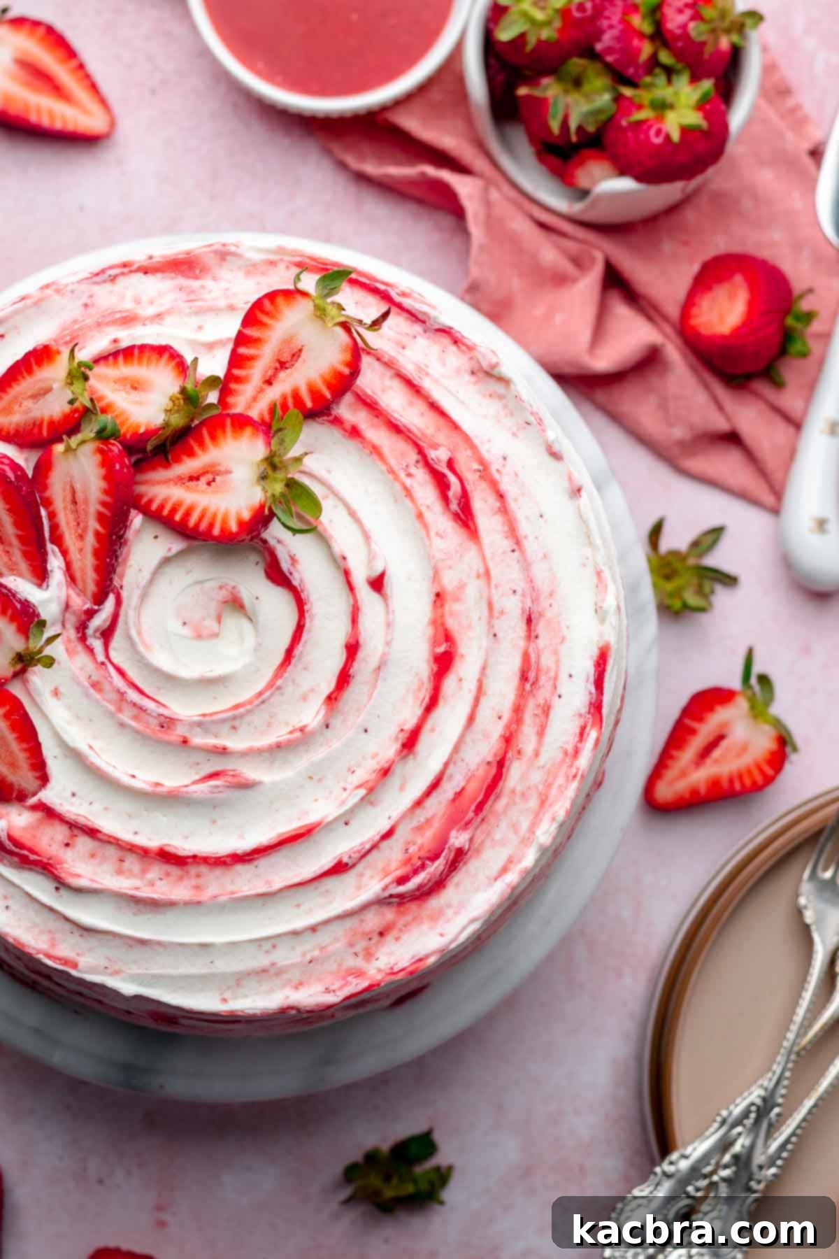 Strawberry shortcake layer cake on a platter.