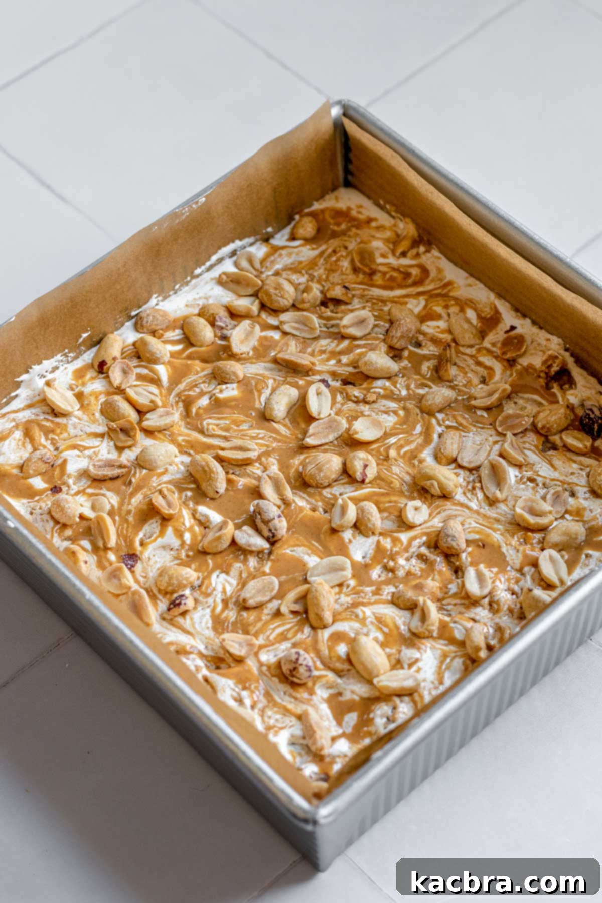 Decadent Fluffernutter Fudge 13 The completed peanut butter marshmallow fluff fudge, adorned with roasted peanuts and flaky sea salt.