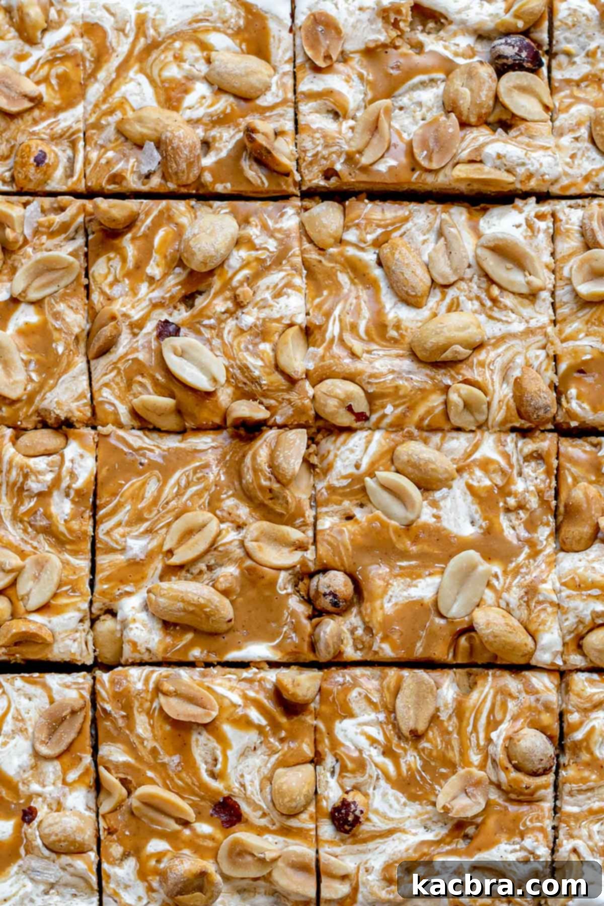 Decadent Fluffernutter Fudge 14 A close-up view of a perfectly cut square of fluffernutter fudge, showing its creamy texture and toppings.