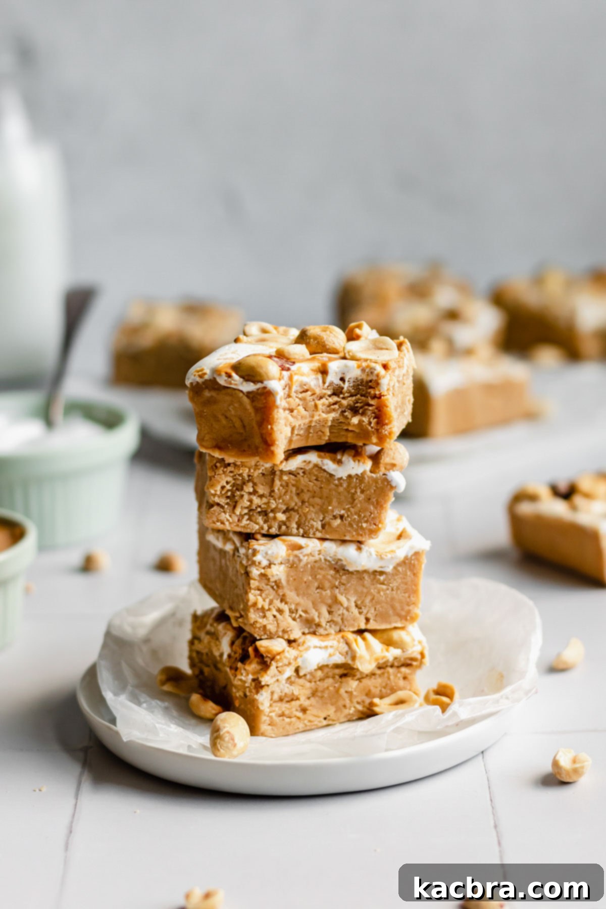 Decadent Fluffernutter Fudge 15 A beautifully stacked tower of peanut butter marshmallow fluff fudge squares, ready to be enjoyed.