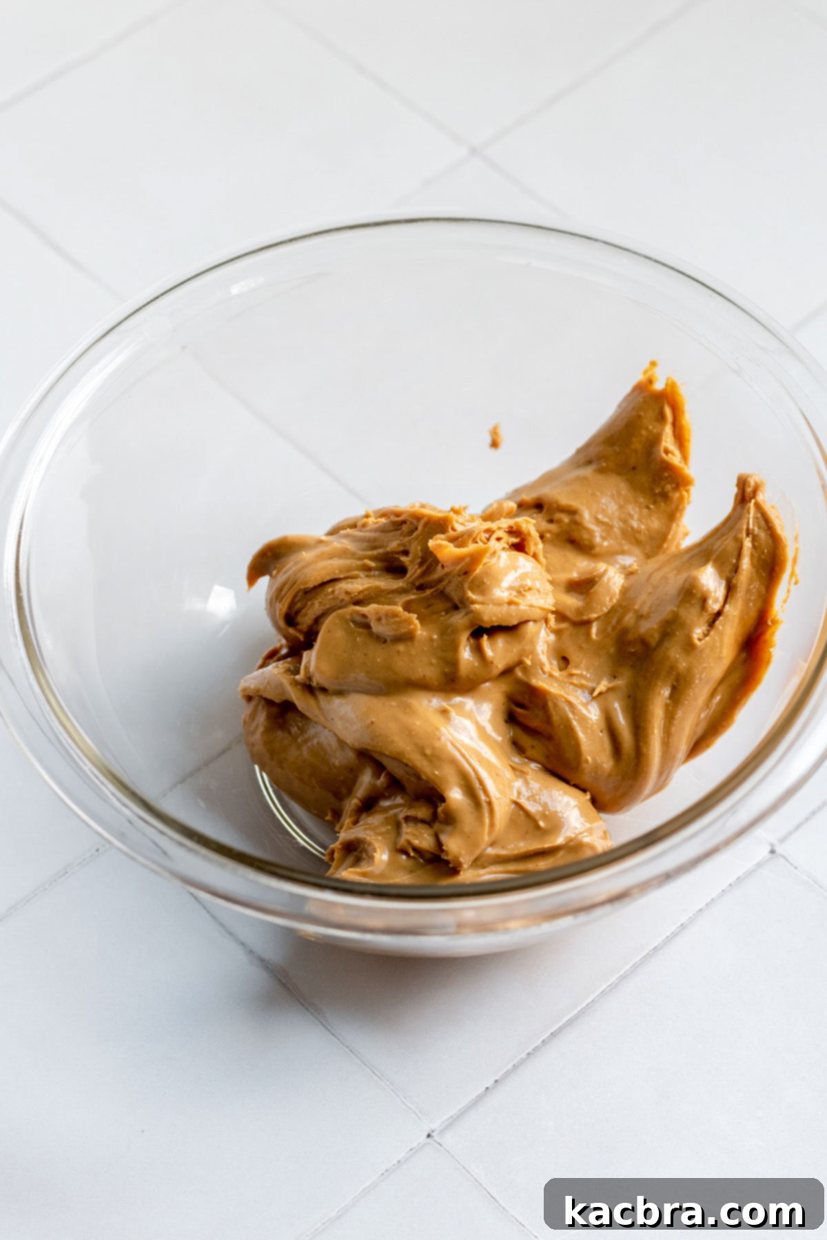 Decadent Fluffernutter Fudge 4 Creamy peanut butter in a large mixing bowl, ready for the next ingredient.