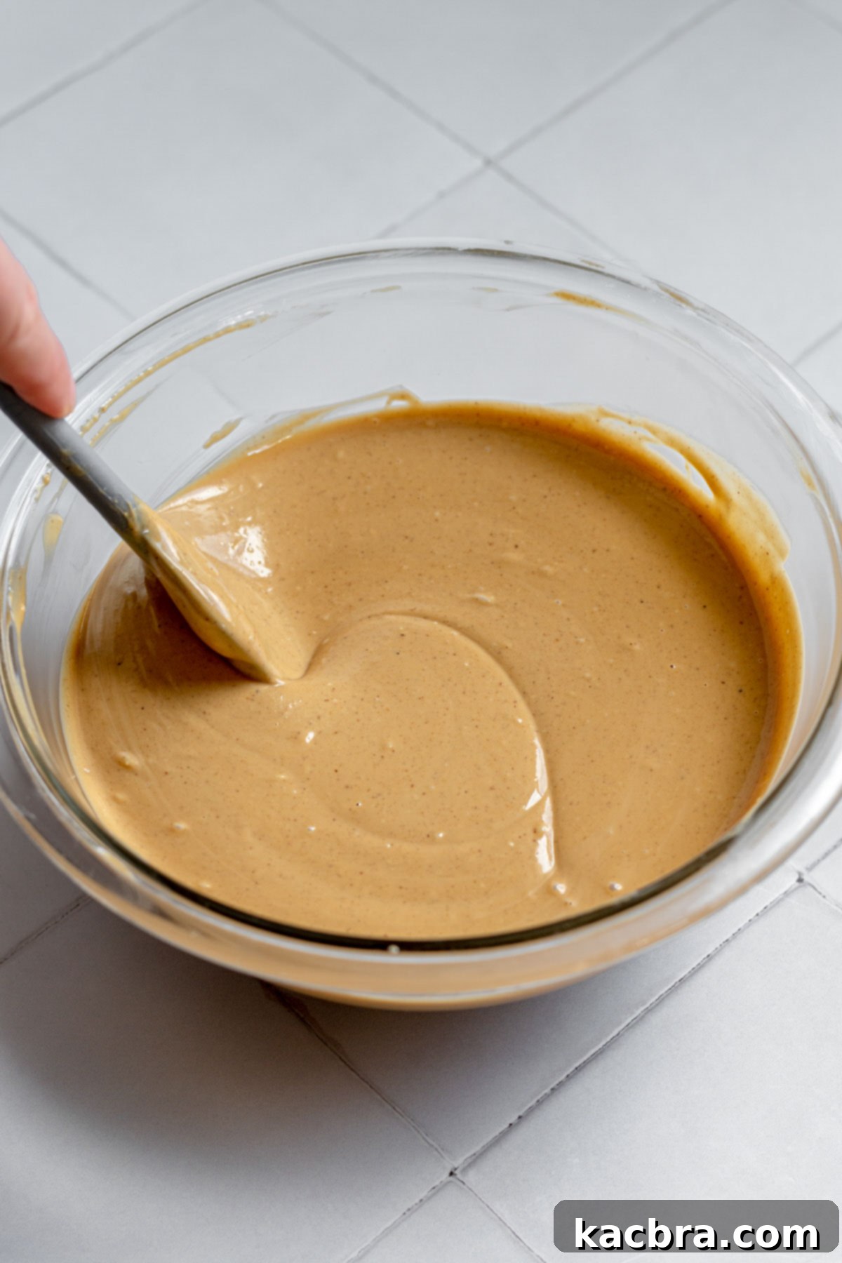 Decadent Fluffernutter Fudge 6 A perfectly smooth and glossy peanut butter and white chocolate mixture after melting and stirring.