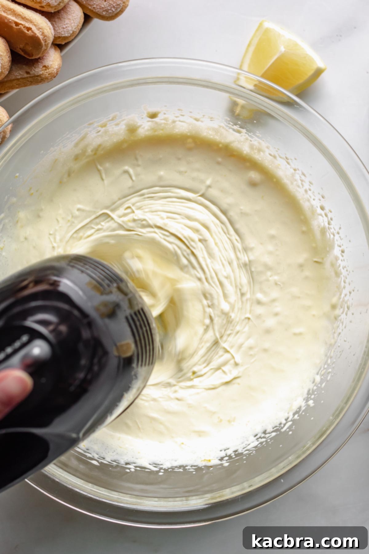 Whipping the lemon mascarpone cream in a stand mixer.