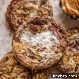 Gooey Peanut Butter Marshmallow Chocolate Cookies 10 Peanut butter marshmallow chocolate cookie on top of cookies.