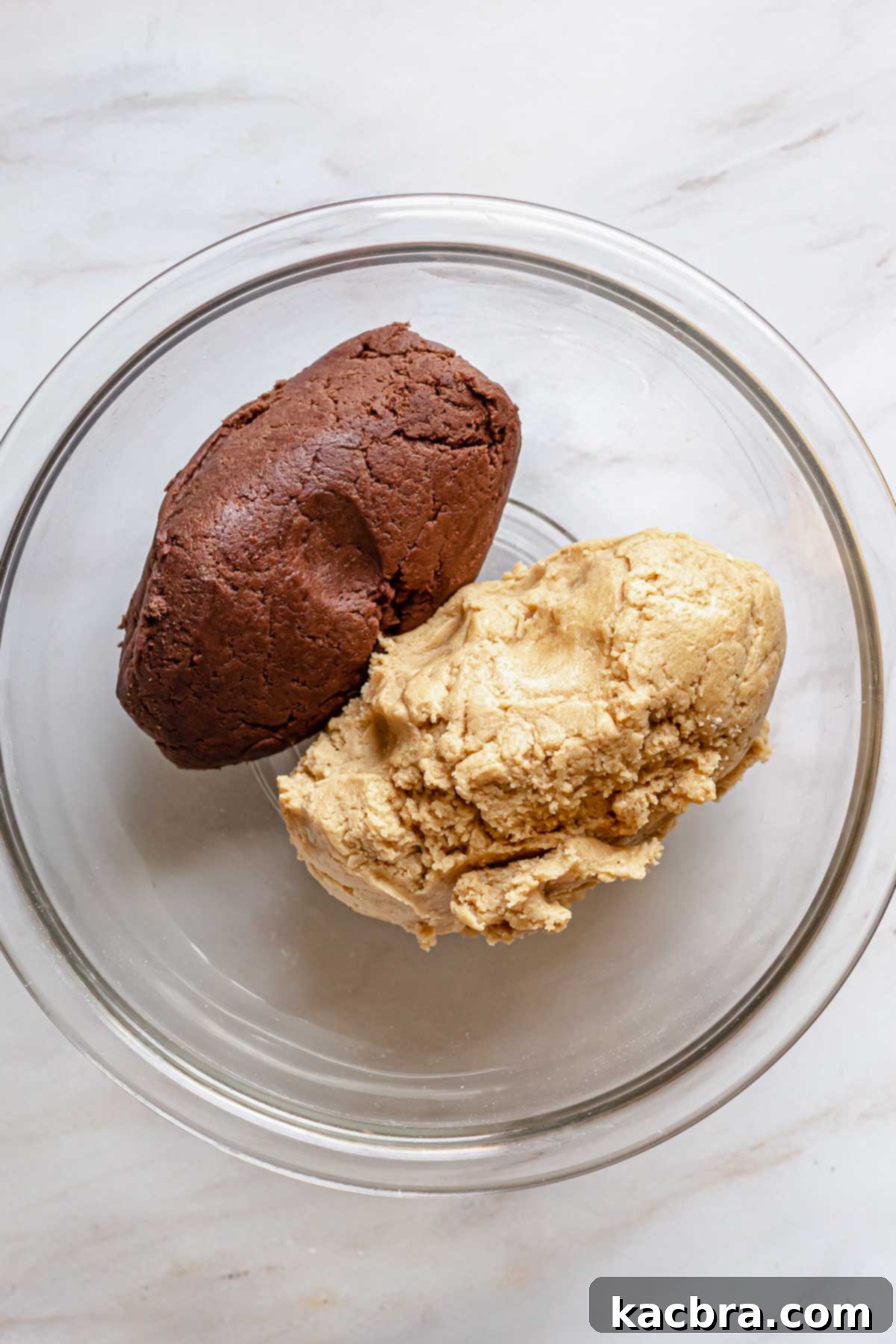Gooey Peanut Butter Marshmallow Chocolate Cookies 5 Chocolate and peanut butter doughs in a bowl.