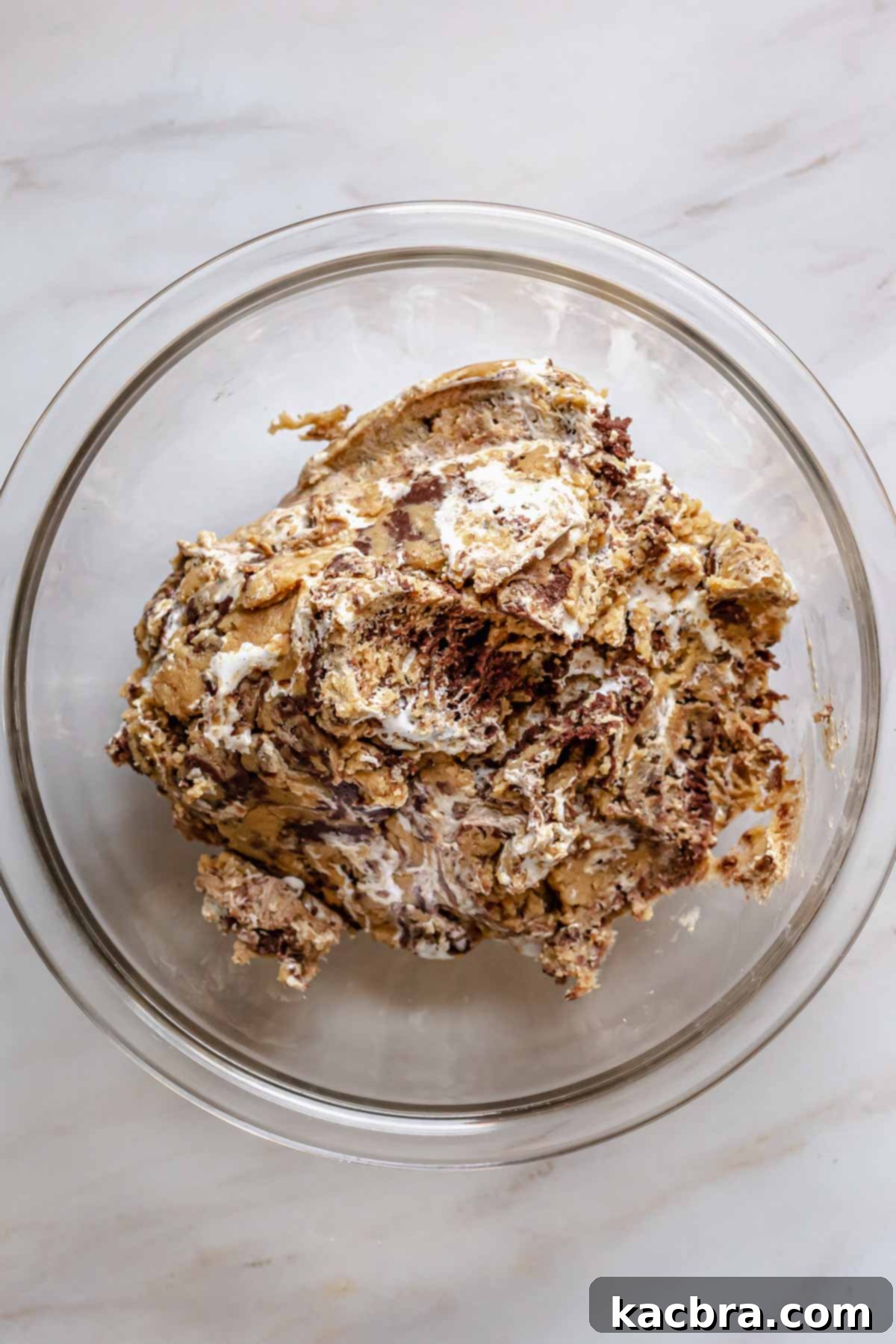 Gooey Peanut Butter Marshmallow Chocolate Cookies 7 Marbled dough in a bowl ready to scoop.