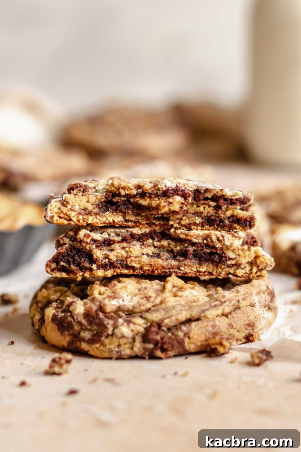Gooey Peanut Butter Marshmallow Chocolate Cookies 9 Stack of peanut butter marshmallow chocolate cookies. One is broken in half.